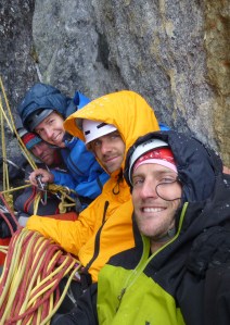 The team huddled on a ledge contemplating waiting or retreating