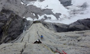 Wilki climbing the crux pitch of The Lotus Flower Tower