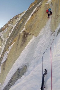Finn on the thin ice seam that leads up to the crux of the route - a tenuous dry tooling traverse