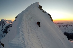 Muzz reaching the summit ridge at sunset