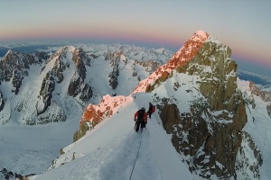 The team descending the ridge to access the Whymper Couloir