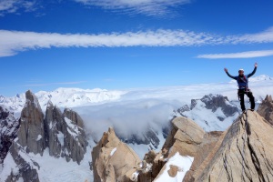 Finn McCann on the summit of the Aguja de Poincenot