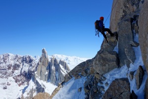 Wilki abseiling with Cerro Torre behind